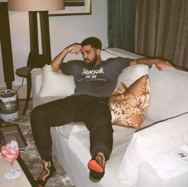 Cute photo of Drake chilling at home with a glass of wine